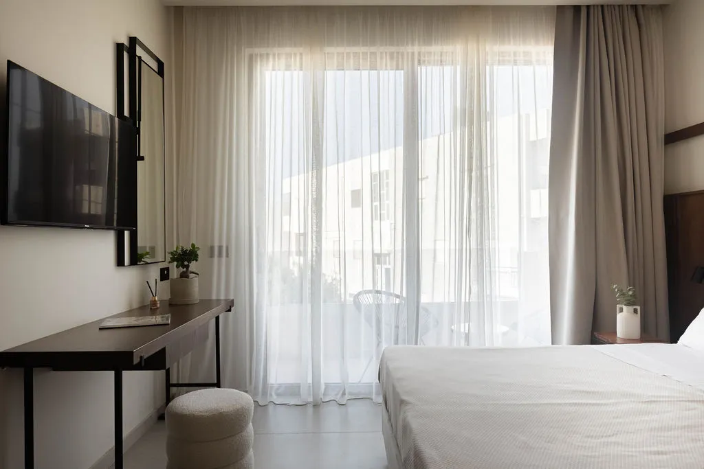 Bedroom opening to a private balcony